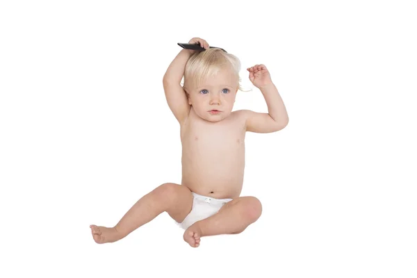 Young boy with black comb — Stock Photo, Image