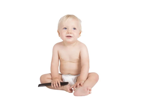 Young boy with black comb — Stock Photo, Image