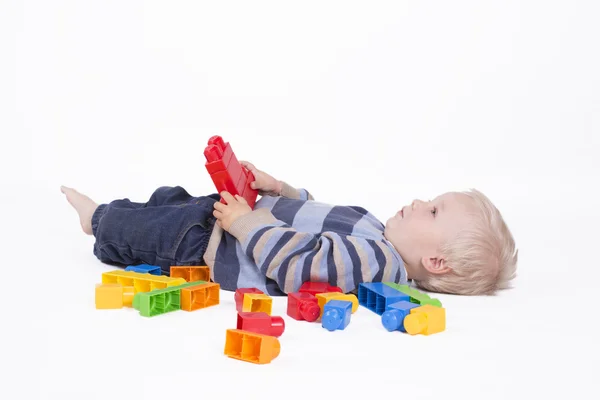 Boy playing with cubes — Stock Photo, Image