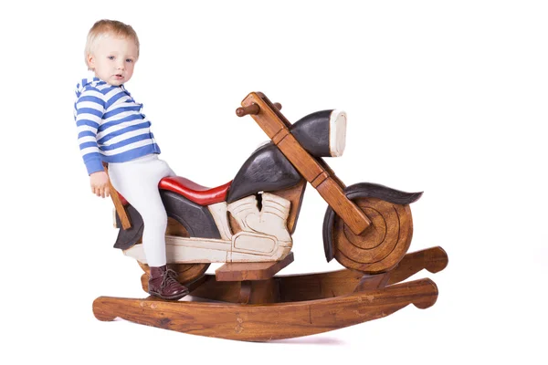 Boy and wooden motorbike — Stock Photo, Image