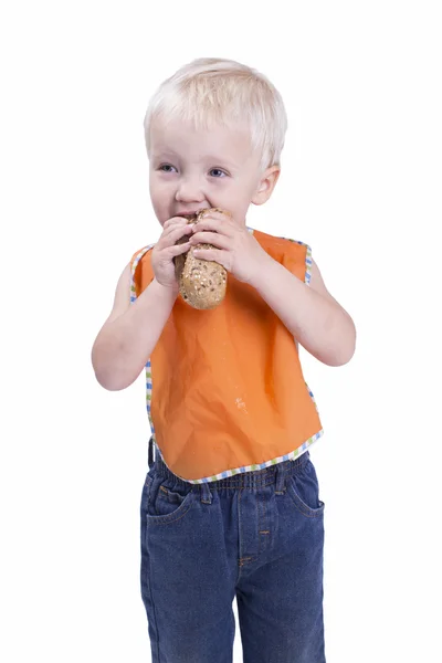 Menino comendo baguete — Fotografia de Stock