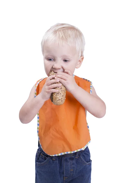 Menino comendo baguete — Fotografia de Stock