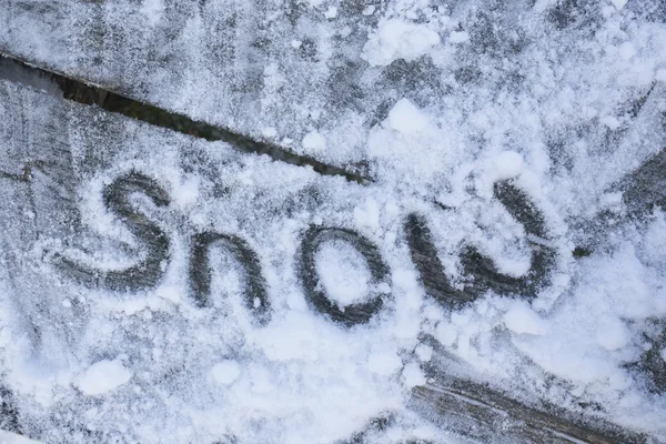Sign SNOW on the snow — Stock Photo, Image