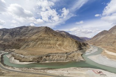 Top view of confluence of rivers Indus and Zanskar looks enticing from hill road going towards Nemo village.Leh Ladakh, India clipart