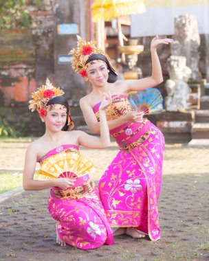 BALI - June 27 2015 : girl performing traditional Indonesian dan clipart