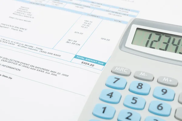 Unpaid utility bill and calculator over it series — Stock Photo, Image