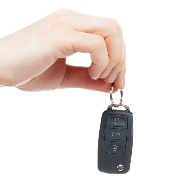 Close up studio shot of a male hand holding car keys — Stock Photo, Image