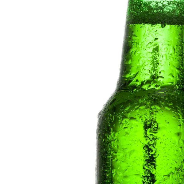 Close up shot of a green beer bottle with water drops over white background - Stock-foto
