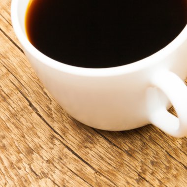 Close up studio shot of a cup of strong black coffee
