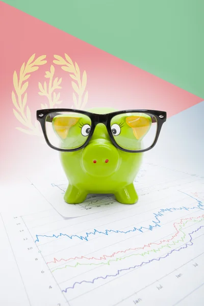 Piggy bank with flag on background - Eritrea — Stock Photo, Image