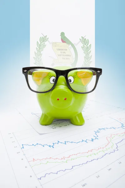 Piggy bank with flag on background - Guatemala — Stock Photo, Image