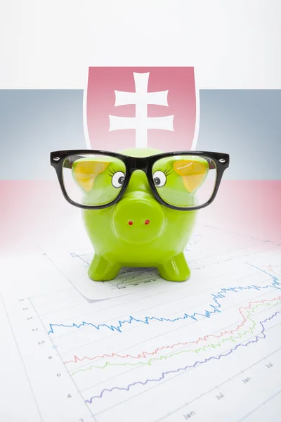 Piggy bank with flag on background - Slovakia — Stock Photo, Image