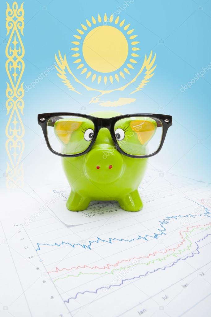 Piggy bank with flag on background - Kazakhstan