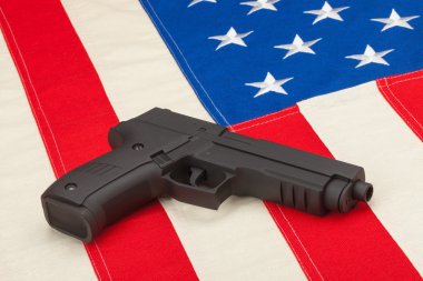 Handgun over USA flag