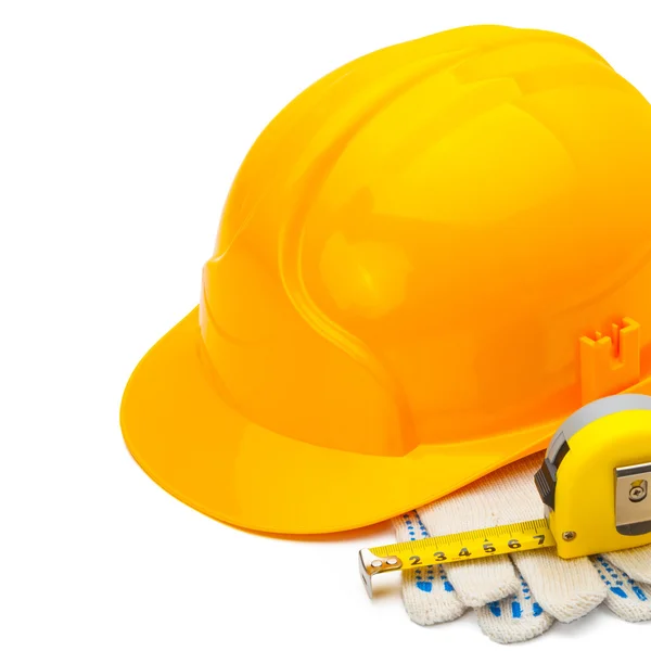 Construction helmet with measure tape and gloves on white background - 1 to 1 ratio — Stock Photo, Image