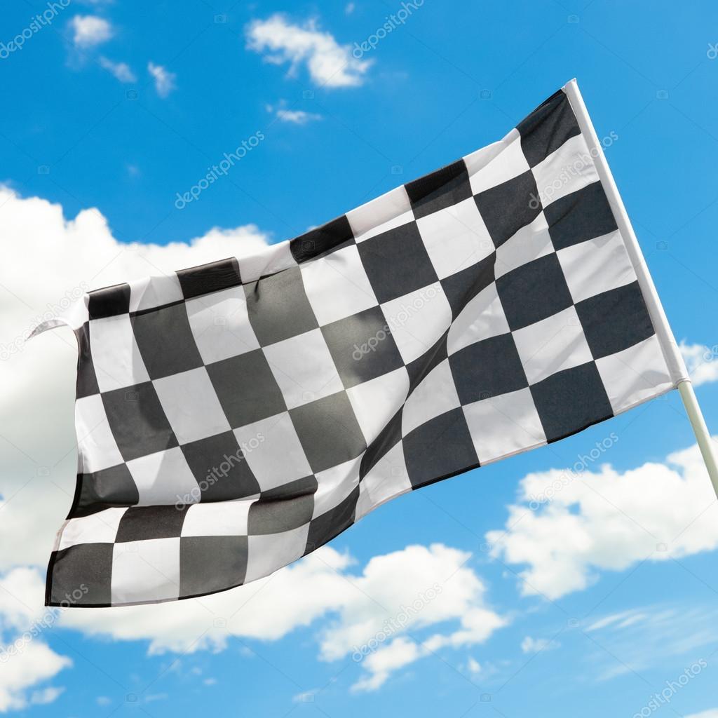 Checkered flag waving in the wind with white clouds on background - 1 to 1 ratio