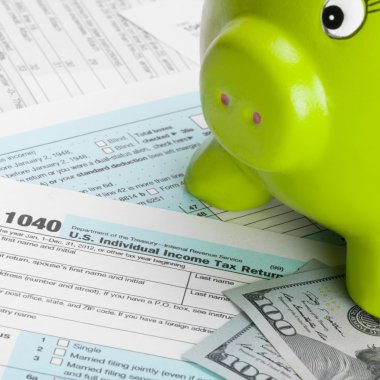 US Tax Form 1040 with piggy bank and 100 dollars - 1 to 1 ratio clipart
