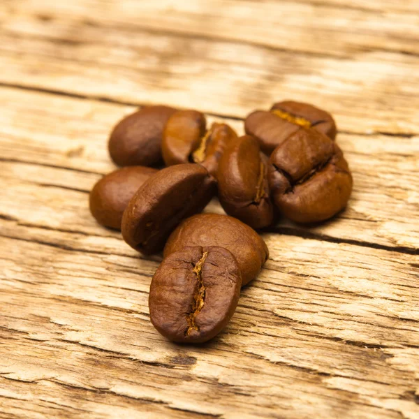 Coffee beans on old wooden table - 1 to 1 ratio — Stock Photo, Image
