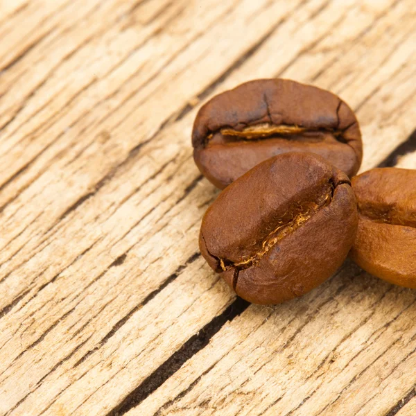 Coffee beans on wooden table - 1 to 1 ratio — Stock Photo, Image