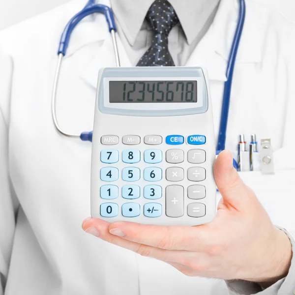 Medical doctor with calculator in his left hand - 1 to 1 ratio — Stock Photo, Image