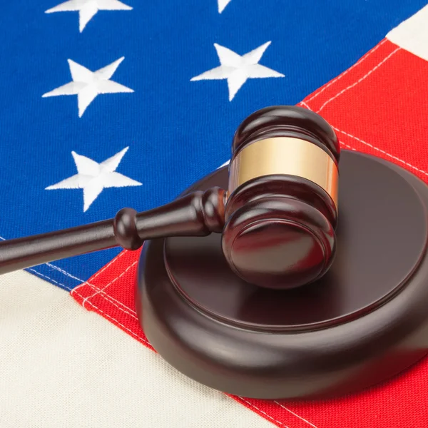 Studio shot of wooden judge gavel and soundboard over USA flag - 1 to 1 ratio — Stock Photo, Image