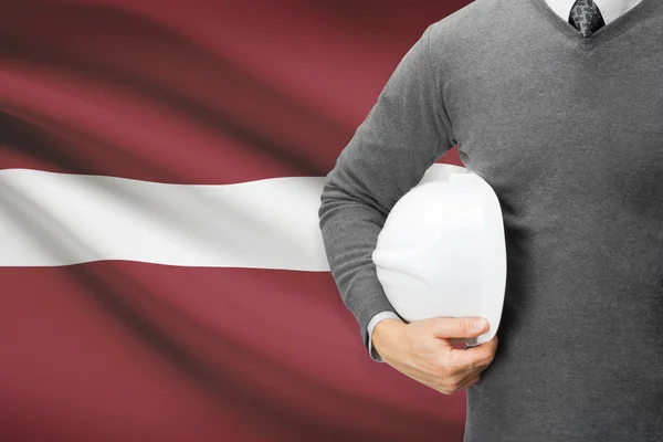 Arquitecto con la bandera en el fondo - Letonia —  Fotos de Stock