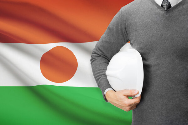 Architect with flag on background  - Niger