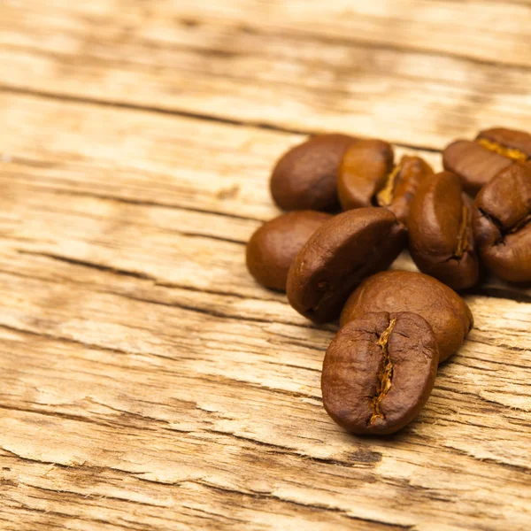 Coffee beans on old wooden table - 1 to 1 ratio — Stock Photo, Image