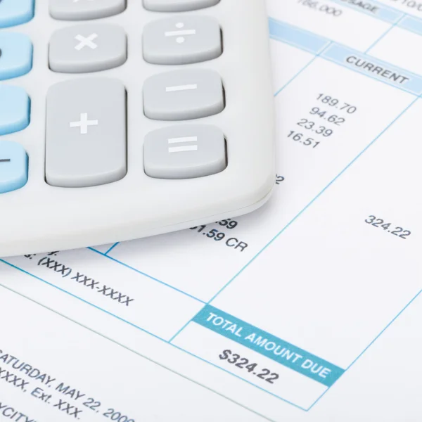 Calculator and utility bill - 1 to 1 ratio — Stock Photo, Image