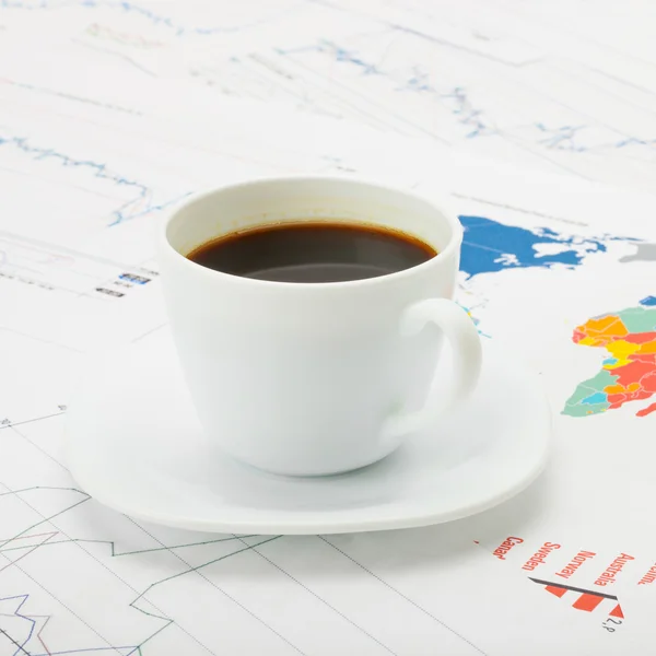 Cup of coffee over world map and financial chart - 1 to 1 ratio — Stock Photo, Image