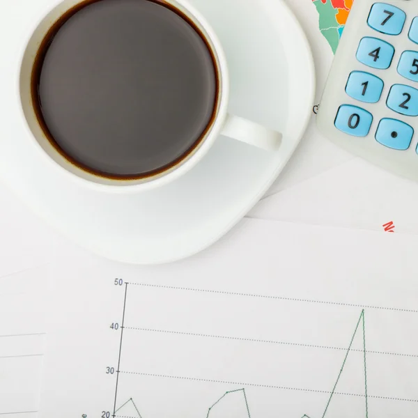 Coffee cup over financial charts - view from top - 1 to 1 ratio — Stock Photo, Image