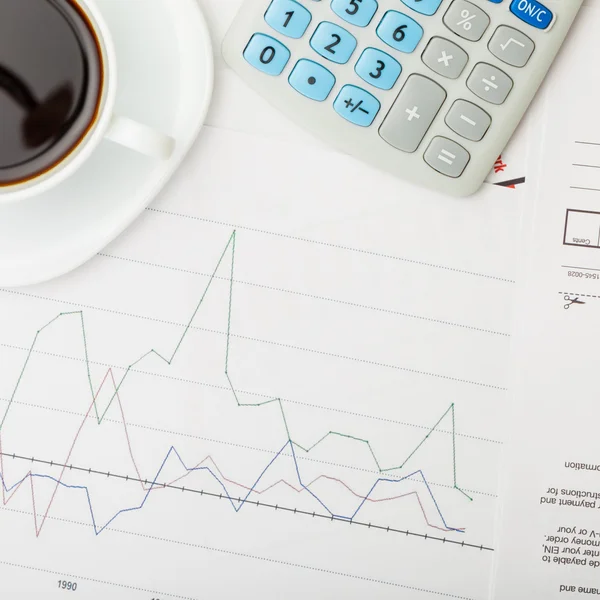 Coffee cup over some financial charts - view from top - 1 to 1 ratio — Stock Photo, Image