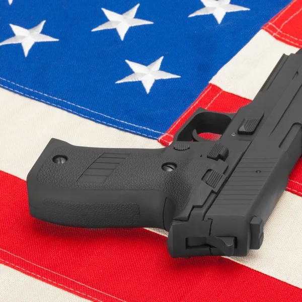 Pistola en proporción de 1 a 1 bandera - studio rodar - usa —  Fotos de Stock