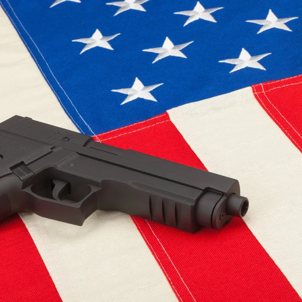 Gun over USA flag - 1 to 1 ratio — Stock Photo, Image