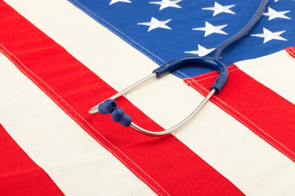 Blue stethoscope over US flag - studio shoot — Stock Photo, Image