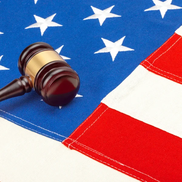 Wooden judge gavel over USA flag — Stock Photo, Image