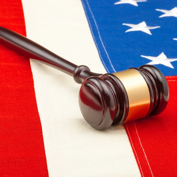 Wooden gavel over USA flag — Stock Photo, Image