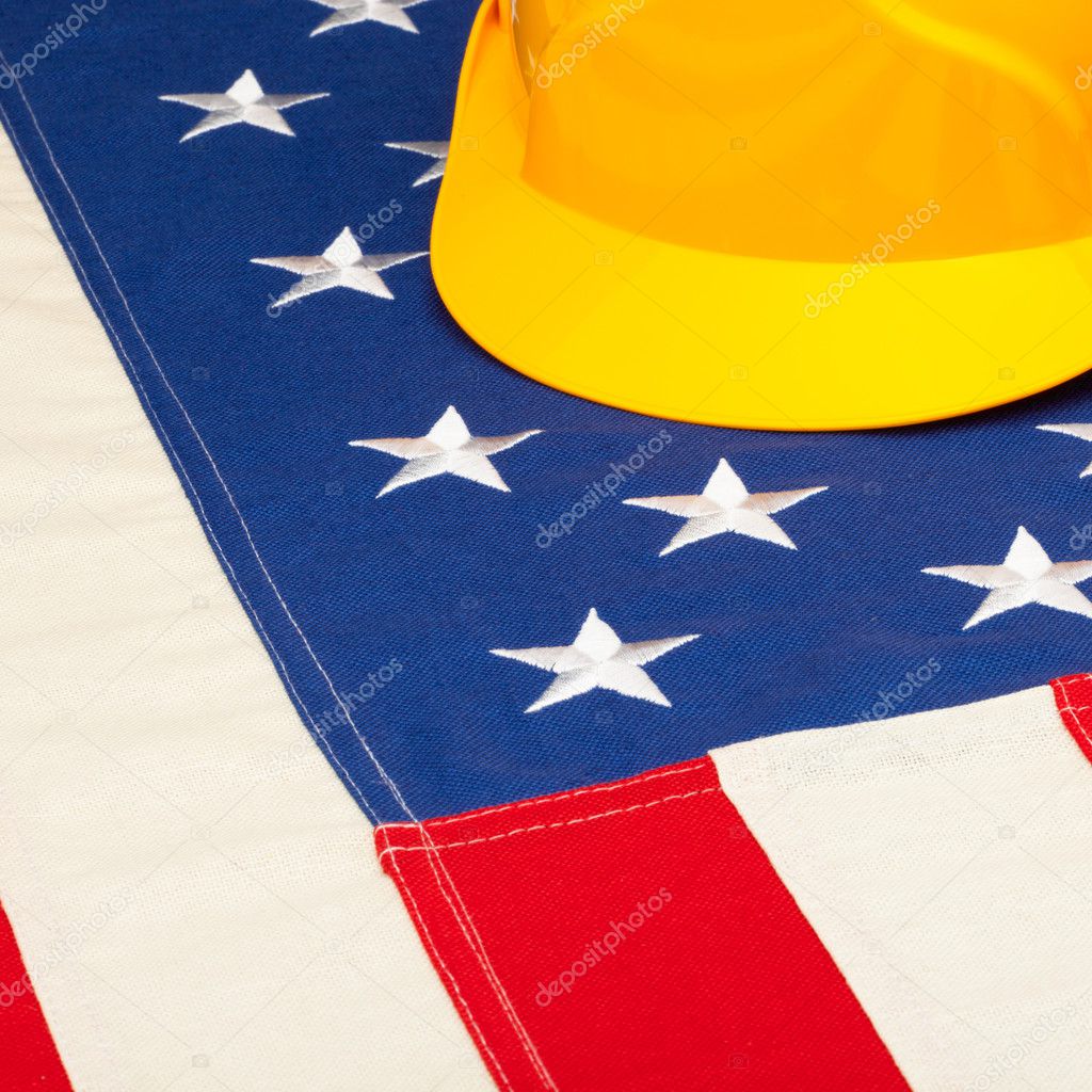 Construction helmet over US flag - closeup shoot
