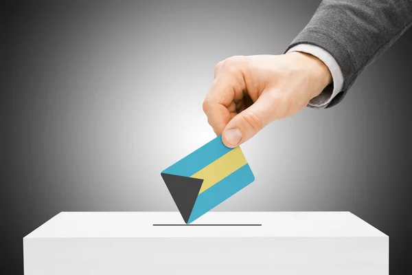 Voto concepto - hombre bandera insertar en urna - Bahamas — Foto de Stock