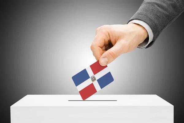 Voting concept - Male inserting flag into ballot box - Dominican Republic — Stock Photo, Image