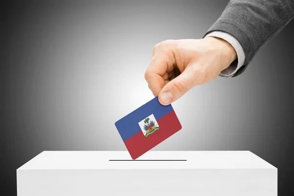 Voting concept - Male inserting flag into ballot box - Haiti — Stock Photo, Image