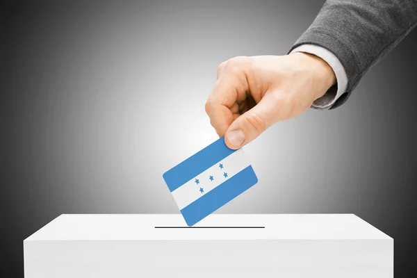 Voting concept - Male inserting flag into ballot box - Honduras — Stock Photo, Image