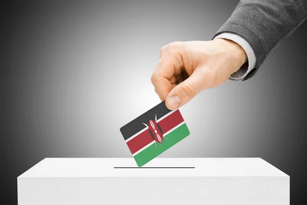 Voting concept - Male inserting flag into ballot box - Kenya — Stock Photo, Image