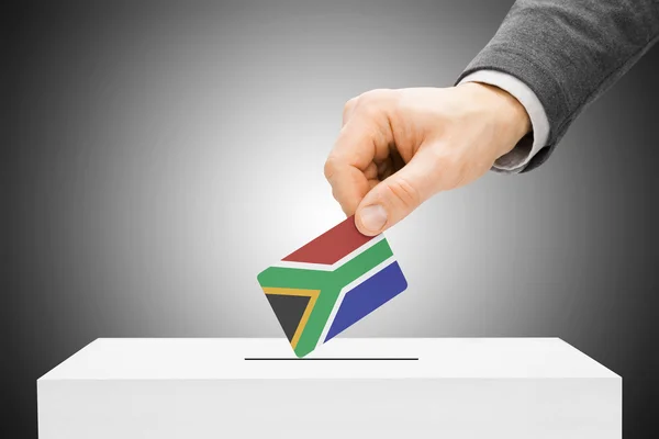 Voting concept - Male inserting flag into ballot box - South Africa — Stock Photo, Image