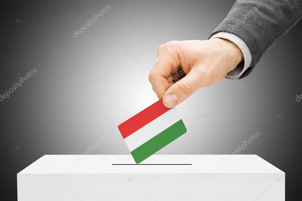 Voting concept - Male inserting flag into ballot box - Hungary