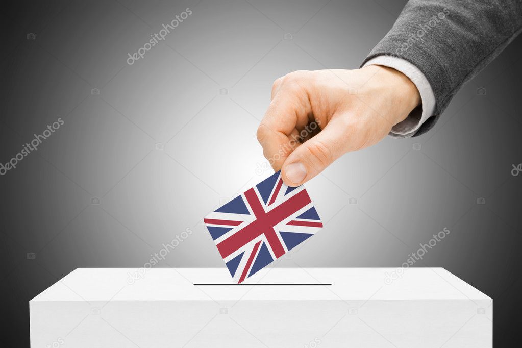 Voting concept - Male inserting flag into ballot box - United Kingdom