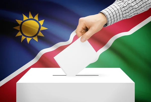 Voto concepto - urna con la bandera nacional de fondo - Namibia —  Fotos de Stock