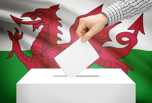 Voting concept - Ballot box with national flag on background - Wales — Stock Photo, Image