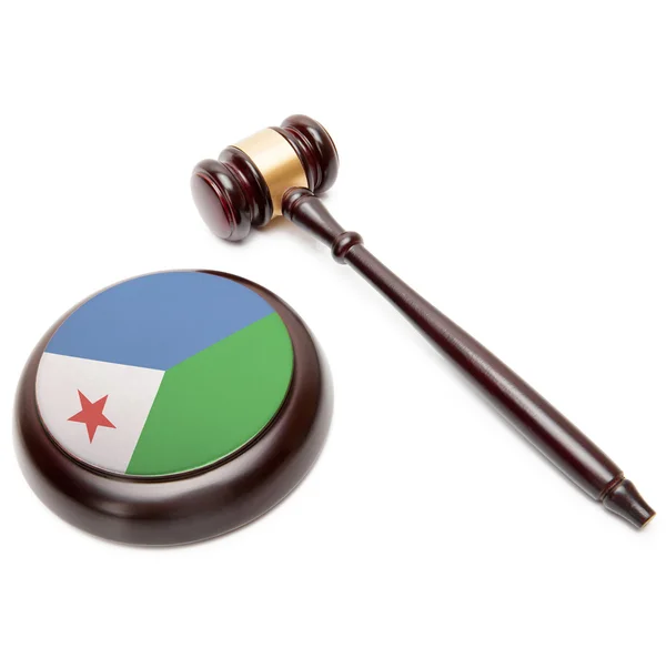 Judge gavel and soundboard with national flag on it - Djibouti — Stock Photo, Image