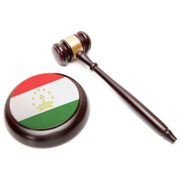 Judge gavel and soundboard with national flag on it - Tajikistan — Stock Photo, Image